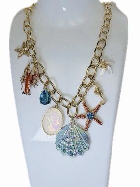 Gold-Tone Coastal Charm Necklace with Iridescent Shell and Blue Accents